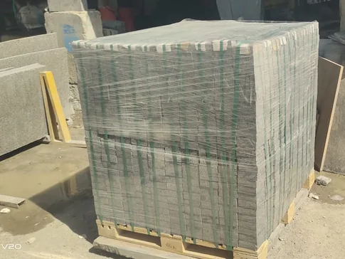 Stone tiles strapped and wrapped on a pallet