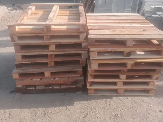 Stacked timber pallets ready for loading